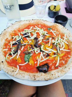 Thin and crusty dough with organic veggies and homemade tasty tomato sauce! at NONA in Brussels