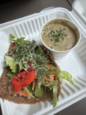 Onion ranch wrap with crumbles walnuts and veggies. Broccoli cashew soup on the side. Both amazing. These wraps are to die for!  at Mama Roots in Duluth