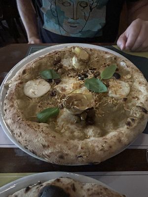 Mozzarella, artichoke, olive pizza  at Organic Pizza & Food in Milan