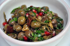 Olive Salad with Wild Thyme
Seedless "halhalı" olives, pickled thyme, sun-dried urfa tomatoes, walnuts, pomegranates and fresh herbs (Vegan)  at Nevale Mutfak in Istanbul