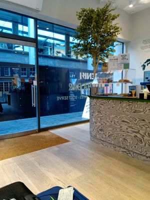 Entrance from the market and display with sweet treats at Jenki in East London