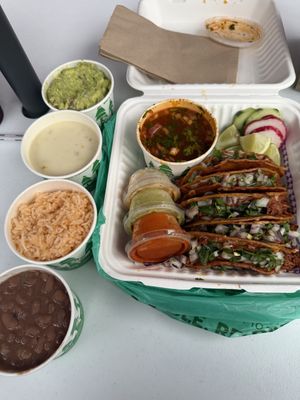 Birria tacos, guac, queso, rice, beanss  at Calaveritas in Atlanta