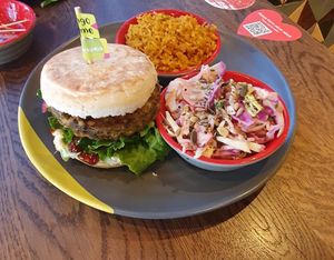 Chickpea burger, spicy rice, rainbow slaw at Nando's in Walkden