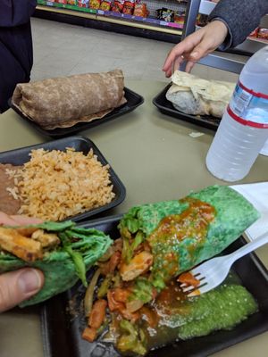 Ultimate vegan burrito (green), rice and beans, bean and potato burrito (white), and bean and rice burrito (brown). Yum!! at Liticker's in San Diego