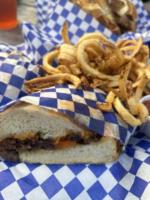 Cheesesteak and curly fries   at Cozo Grill in Portland