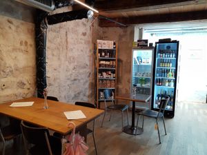 Indoor seating and small shop at Vigneron Weinbistro in Bern