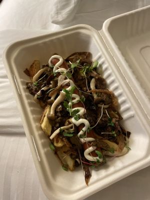 Hot dog on fries  at Good Dogs Plant Foods in Vancouver