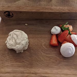 Pine nut and coconut dessert with strawberries   at The Garden Kitchen in Ansty