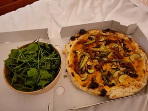 Vegan pizza and green leaves at Pizzamania in Bucharest