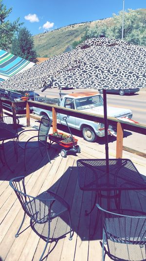 Outdoor seating with a view of the mountains! at Tumbleweeds Bookstore and Cafe in Gardiner