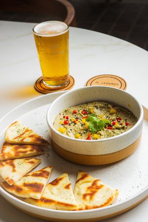 Smokey Babaganoush - sesame seeds, fresh coriander, garlic, served with pita breads at LEGENDS - Bistro Bar and Sports in Canggu