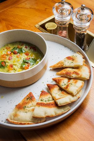 Homamade Guacamole - butter avocado, tomato, fresh coriander, served with pita breads at LEGENDS - Bistro Bar and Sports in Canggu
