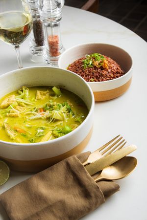 Vegan Thai Green Curry - tofu, round eggplant, carrots, cauliflower, served with choice of white or red rice at LEGENDS - Bistro Bar and Sports in Canggu