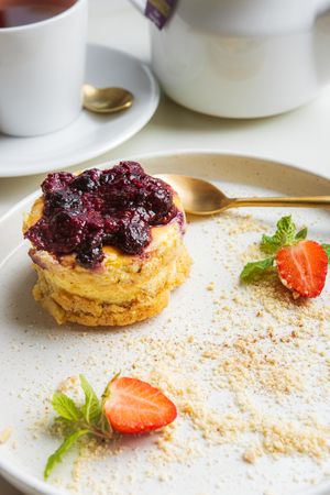 The Raspberry Cheesecake for Champions - topped with homemade raspberry jam and baked crust cookies at LEGENDS - Bistro Bar and Sports in Canggu