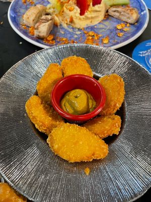 Vegan chicken nuggets with a mustard/curry sauce  at Bar Tomeu in Sitges