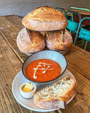 Homemade roasted red pepper, tomato and lentil soup with freshly baked sourdough   at FRÂN Las in Llanberis