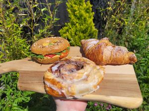 Homemade Hummus and Red Pepper Bagel, Coffee-Cream Filled Crossaint and Homemade Cinnamon Swirl at FRÂN Las in Llanberis