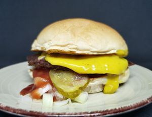 "The Vegans Dirty Secret"
potato bun, beyond beef, vegan cheddar, diced onions, pickles, ketchup and mustard.
The real cheat meal experience that will hit the spot. at Illicit Burgers in Lagos