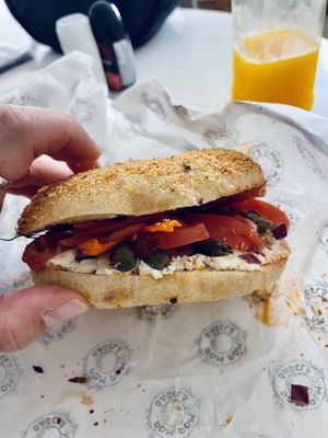 carrot lox, vegan cream cheese (made from tofu, delicious) capers, red onion, tomato and dill  at Pom Pom Bagels in Lagos