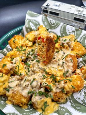 Crab Cake Totchos takes tator tots to the next level. So, so good! at Community Vegan in Austin