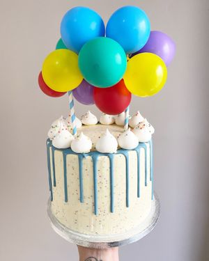 First birthday cake with meringues and and blue chocolate drip! at What Leila Bakes in Swansea