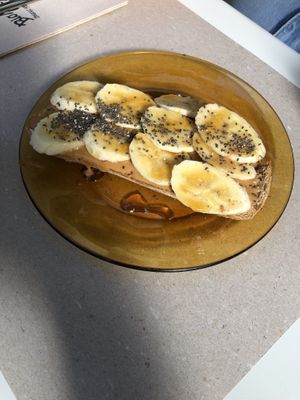 Toast with home made peanut butter and bananas  at Biomio Brunch Ecológico in Sevilla