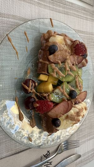 Vegan oat banana waffles with almond creamm  at Biomio Brunch Ecológico in Sevilla