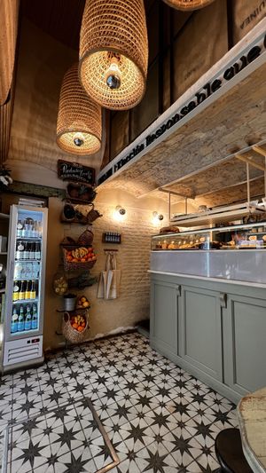 Inside: the fridge has Kombuchas etc. Organic veggies for sale.  at Biomio Brunch Ecológico in Sevilla