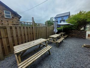 Tŷ Coets Outdoor Seating (ft. a sneaky dog) at The Real Coffee Stop in Beddgelert