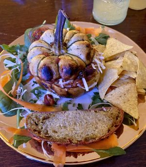 Baked pumpkin with tasty filling, tortilla chips with salsa and bread.   at Caféteket in Slagelse