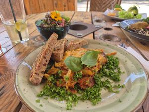 Lasagna with accompanying salad and bread at Caféteket in Slagelse