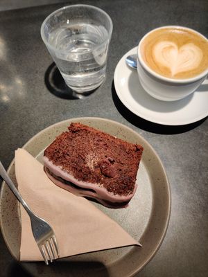 cappuccino with oat milk and chocolate cherry cake at kaffeefabrik in Vienna