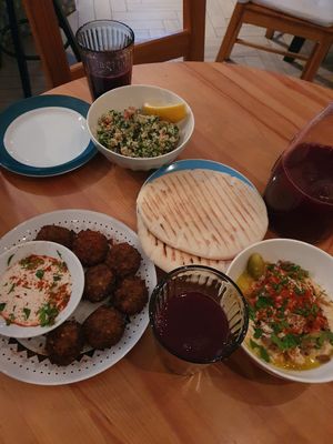 Taboulé, falafel and tahini, humus with mushrooms and onions at Beten Gav in Minsk