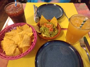 Avocado with tortilla chips, mango and hibiscus juice at La Cantina Mexicana in Sevilla