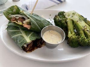 Beyond burger wrapped in collard greens with the roasted broccoli￼  at Christopher's Kitchen in Palm Beach Gardens