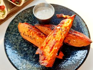 Seasoned Sweet Potato Wedges with an aioli truffle sauce - so delicious!!! at Christopher's Kitchen in Palm Beach Gardens