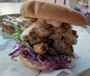 These are Oyster Mushrooms lightly breaded and fried topped with all sorts of goodies ... a Stacked Burger that came with s with a smashed potato herb garlic cake  at Christopher's Kitchen in Palm Beach Gardens