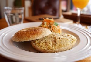 Bagel with hummus and daily deli special.  at Cafe Atl in Osaka