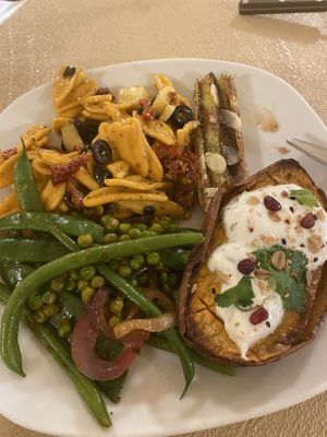 Pasta bio salad + sweet potato with vegan cheese  at La Papa in Barcelona