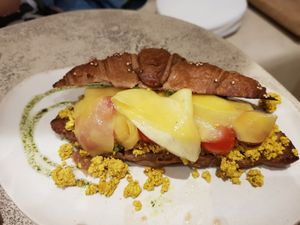 Vegan croissant with tofu and pickled fruit at La Papa in Barcelona