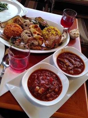 Homemade hibiscus lemonade and vegan mixed plate at Tsnim in Kamnik
