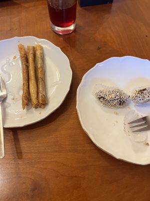 Sweet cigars and peanut filled, sesame covered dates  at Tsnim in Kamnik