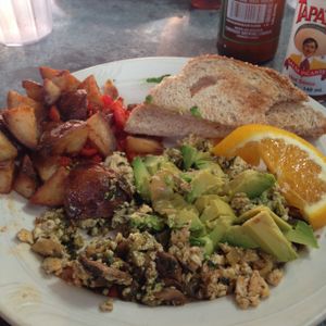 pesto tofu scramble with avocado and home fries! at Downbeat Diner and Lounge in Honolulu