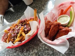 Vegan chili fries and BBQ wings.  at Downbeat Diner and Lounge in Honolulu