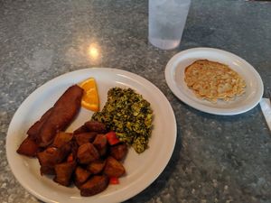 Pesto tofu scramble with vegan bacon, pancakes, and home fries at Downbeat Diner and Lounge in Honolulu