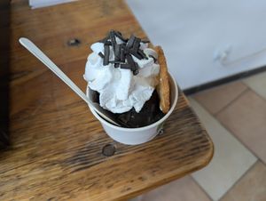 Lakritzbecher: two scoops of licorice ice cream, licorice sauce, licorice sprinkles, whip, more sprinkles. at Die Eisbande in Hamburg