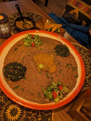 This is the spinach and lentil dish, on top of a giant sharing Eritrean pancake/bread at Wedeb's in Tromsoe