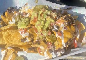 Nachos (partially eaten - couldn’t wait!)  at Tacotarian in Henderson