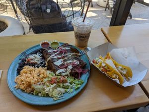 Enchilada plate with Mole and two tacos. at Tacotarian in Henderson