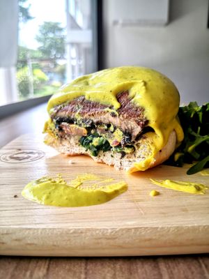 Cross section of the Portobello Benedict Burger at Loving Nature Fortunate Coffee Cafe in Central Singapore